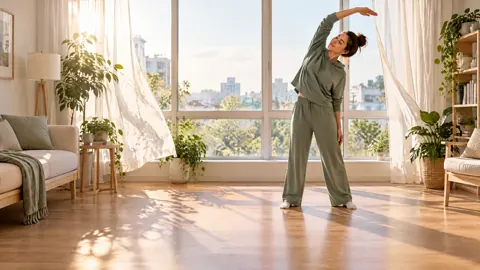 Woman Stretching by Windows