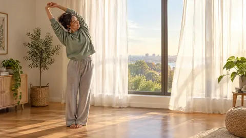 Woman Stretching by Window