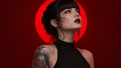 Tattooed Woman Before Scarlet Sun