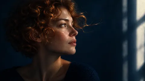 Freckled Woman in Window Light