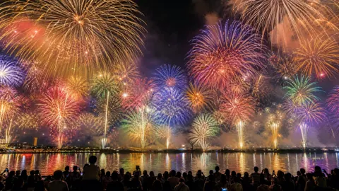 Japanese Fireworks Over River