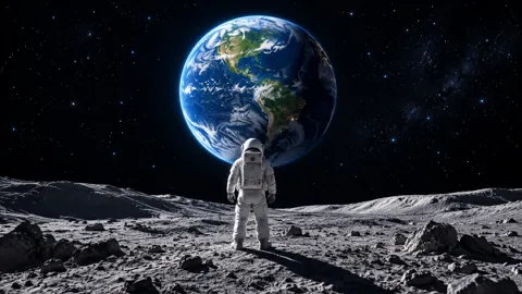 Astronaut Facing Earth Above Moon