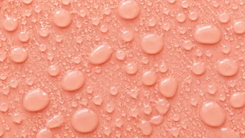 Water Droplets on Peach Surface