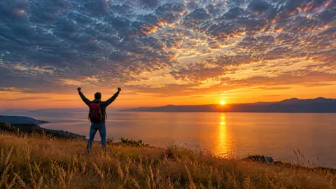 Backpacker Over Coastal Sunset