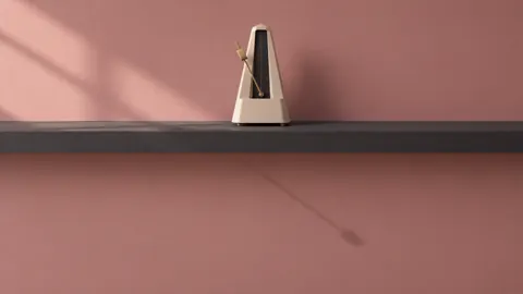 Ivory Metronome on Charcoal Shelf