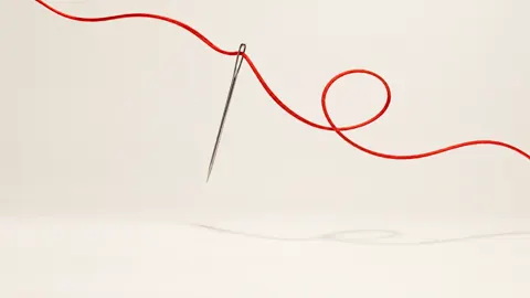 Silver Needle With Red Thread