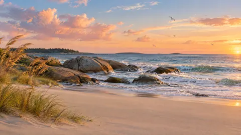 Sunset Shoreline With Granite Boulders